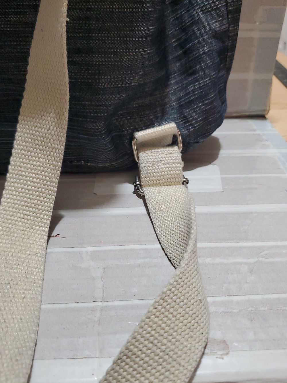 Denim-Look Drawstring Backpack with Cream Strap Details - Picture 8 of 12